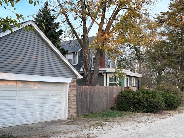 view of property exterior featuring a garage