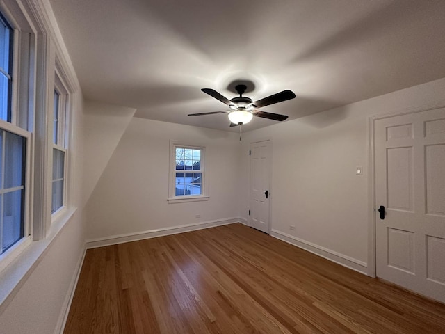 8646 S Nagle Ave, Burbank, IL 60459 - spare room featuring baseboards, ceiling fan, and wood finished floors