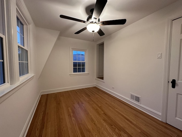 empty room featuring ceiling fan and wood-type flooring