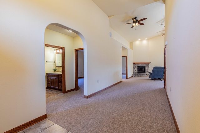 hall featuring light colored carpet