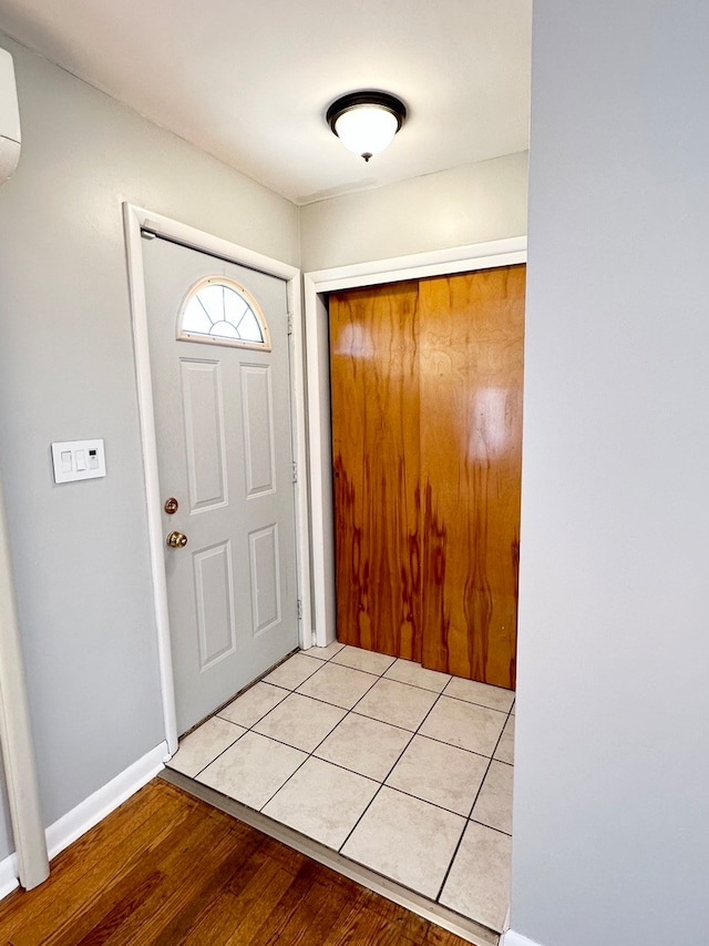 foyer entrance with light hardwood / wood-style flooring