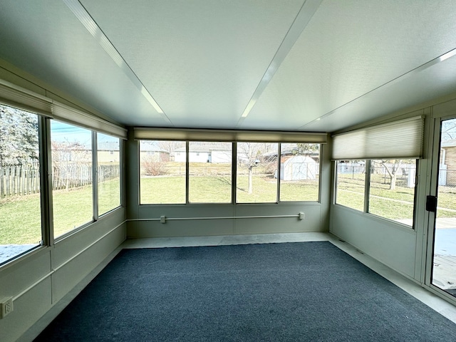 unfurnished sunroom featuring a wealth of natural light