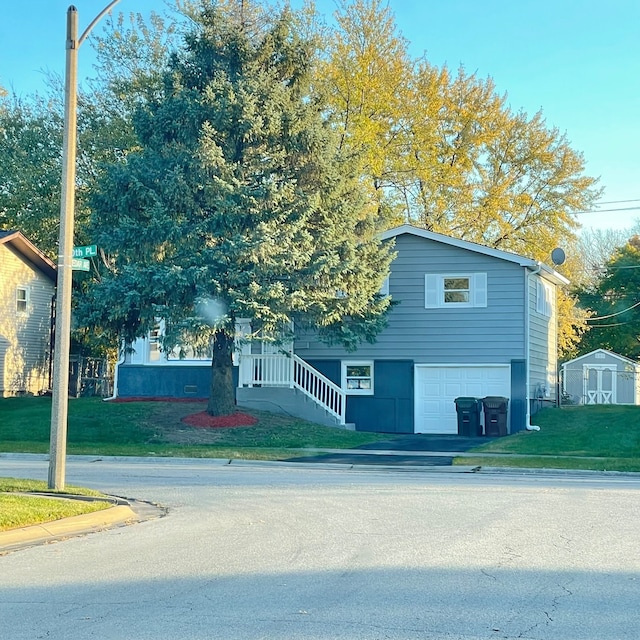 view of front of property featuring a garage and a front yard