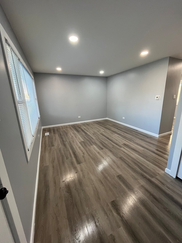 spare room featuring dark hardwood / wood-style flooring