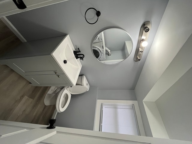 bathroom featuring hardwood / wood-style flooring and toilet