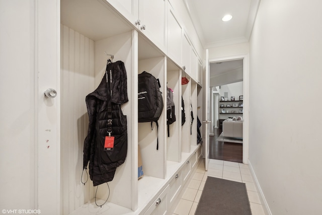 mudroom with crown molding and light hardwood / wood-style flooring