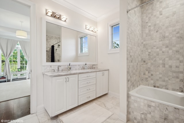 bathroom with vanity, crown molding, and shower / bath combo with shower curtain