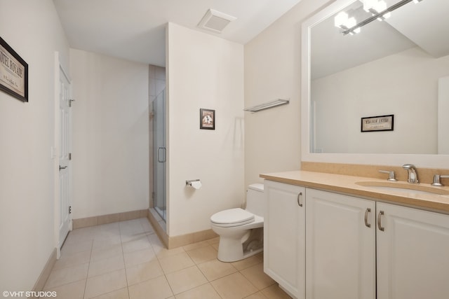 bathroom featuring a shower with door, vanity, toilet, and tile patterned floors