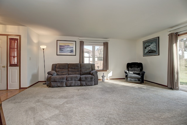 carpeted living room featuring a healthy amount of sunlight