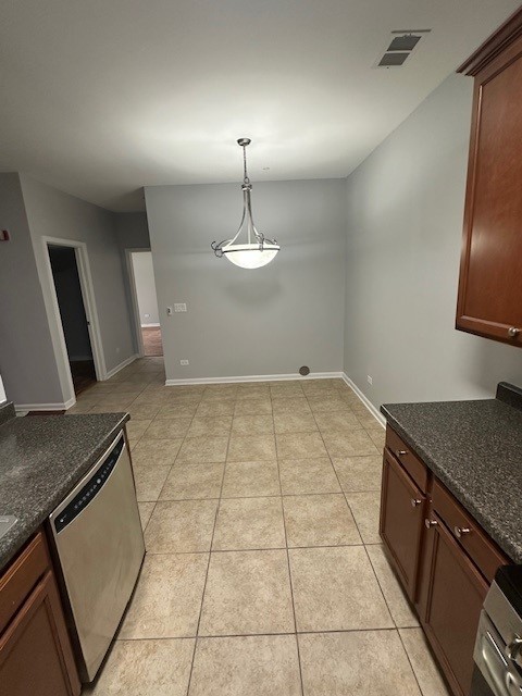 unfurnished dining area with light tile patterned floors