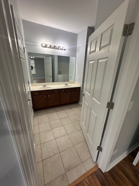 bathroom with vanity and wood-type flooring