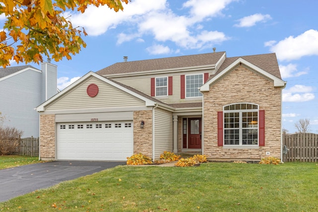 front facade with a garage and a front yard