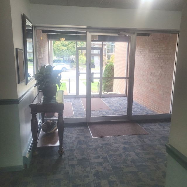 doorway with french doors and brick wall