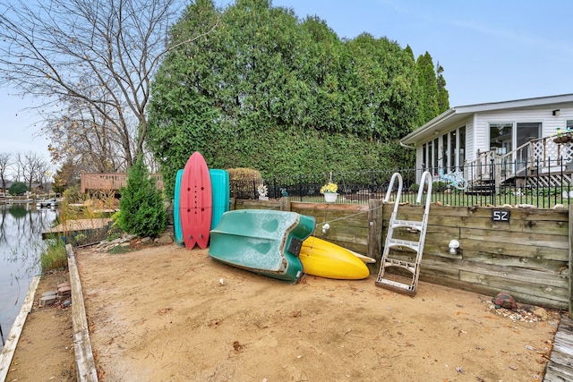 view of jungle gym featuring a water view