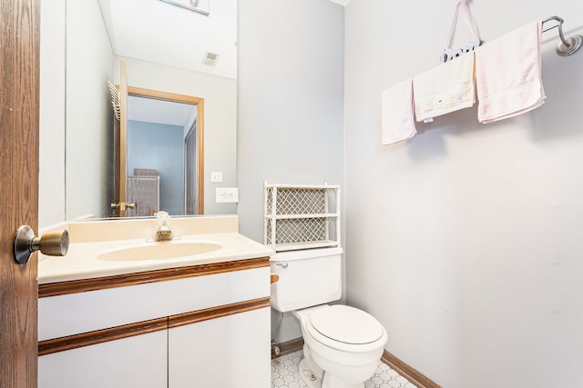 bathroom with vanity and toilet