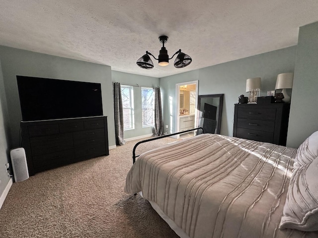 bedroom featuring a textured ceiling, carpet floors, ceiling fan, and connected bathroom