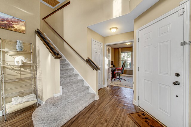 foyer entrance with dark wood-type flooring