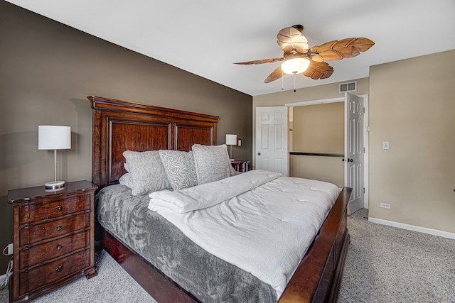 carpeted bedroom with vaulted ceiling and ceiling fan