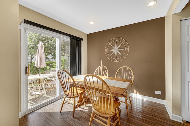 dining space featuring hardwood / wood-style floors