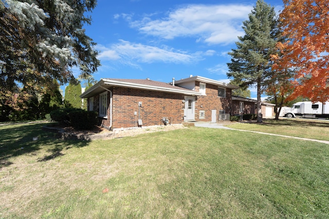 view of side of property featuring a yard