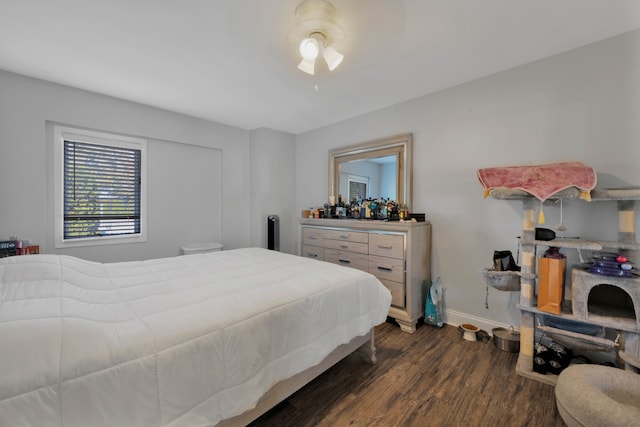 bedroom featuring dark wood-type flooring and ceiling fan