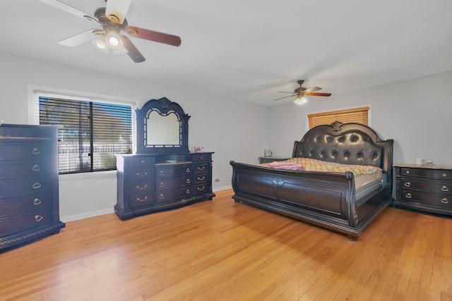 bedroom featuring light hardwood / wood-style floors and ceiling fan