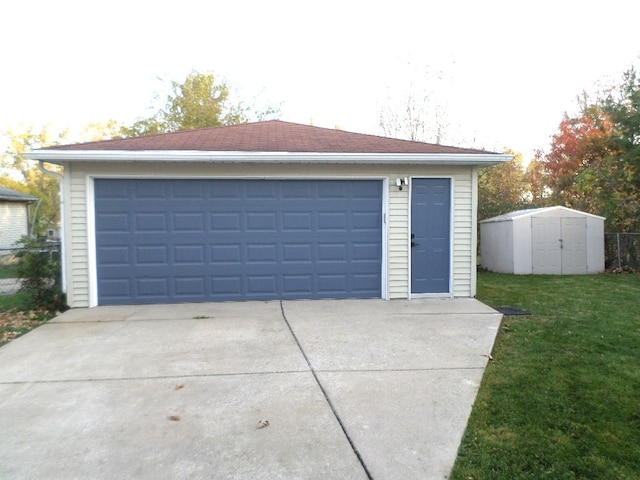 garage featuring a lawn