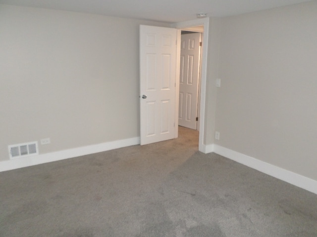 empty room with carpet flooring