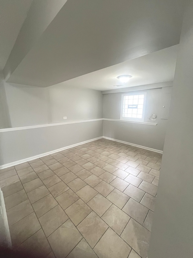 bonus room with light tile patterned floors