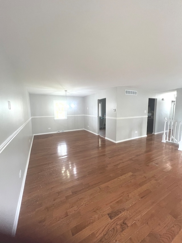 empty room featuring dark wood-type flooring