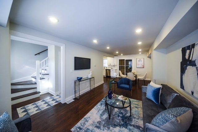 living room featuring dark hardwood / wood-style flooring