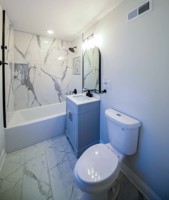 full bathroom with vanity, toilet, and tiled shower / bath