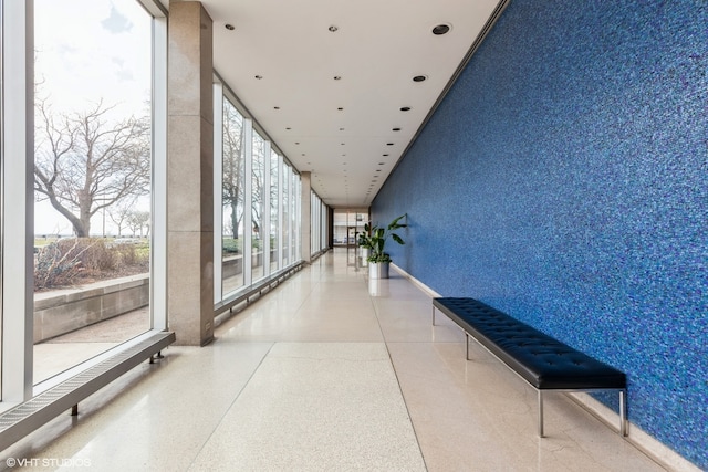 hall featuring expansive windows