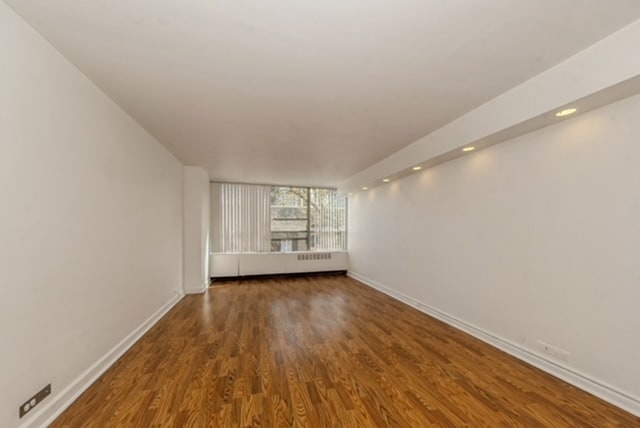 empty room featuring hardwood / wood-style floors