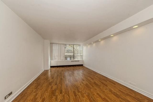 4800 S Chicago Beach Dr Unit 312S, Chicago, IL 60615 - spare room featuring wood finished floors and baseboards