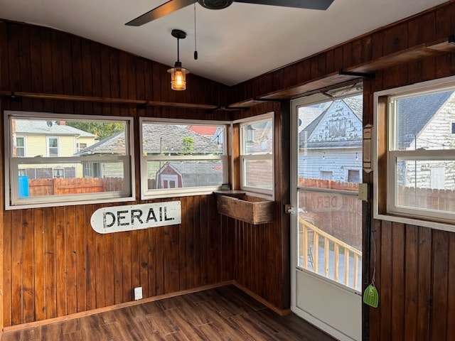 unfurnished sunroom featuring lofted ceiling