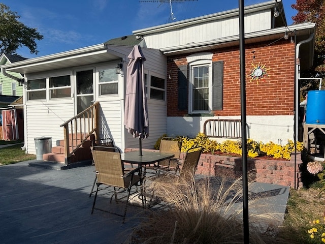 rear view of house featuring a patio