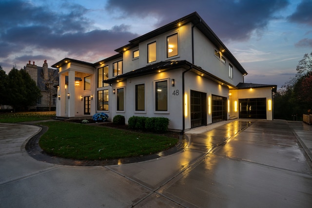 contemporary home featuring a lawn