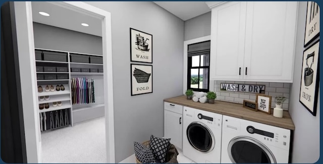 washroom with carpet floors, separate washer and dryer, and cabinets