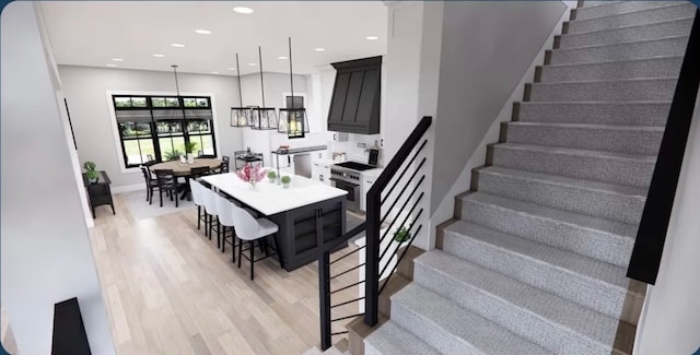 dining area featuring an inviting chandelier and light hardwood / wood-style floors