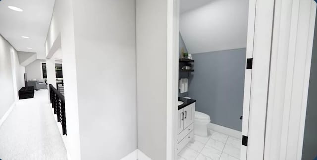 bathroom featuring toilet and vanity