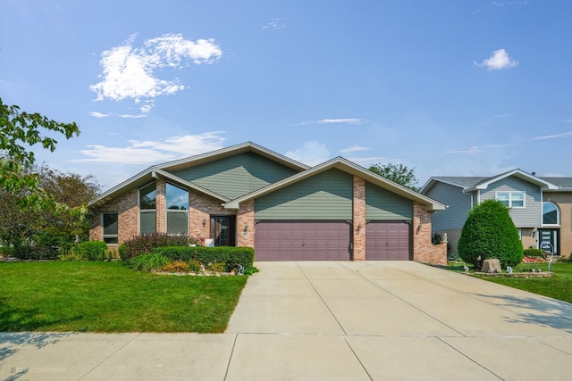 view of front of house with a front yard and a garage