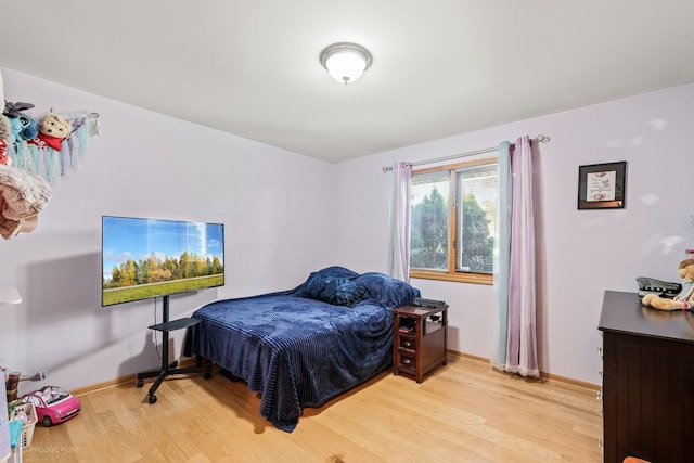 bedroom with light hardwood / wood-style flooring