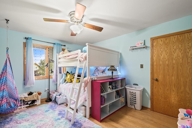 bedroom featuring light hardwood / wood-style floors and ceiling fan