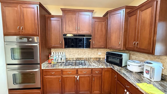 kitchen with decorative backsplash and stainless steel appliances