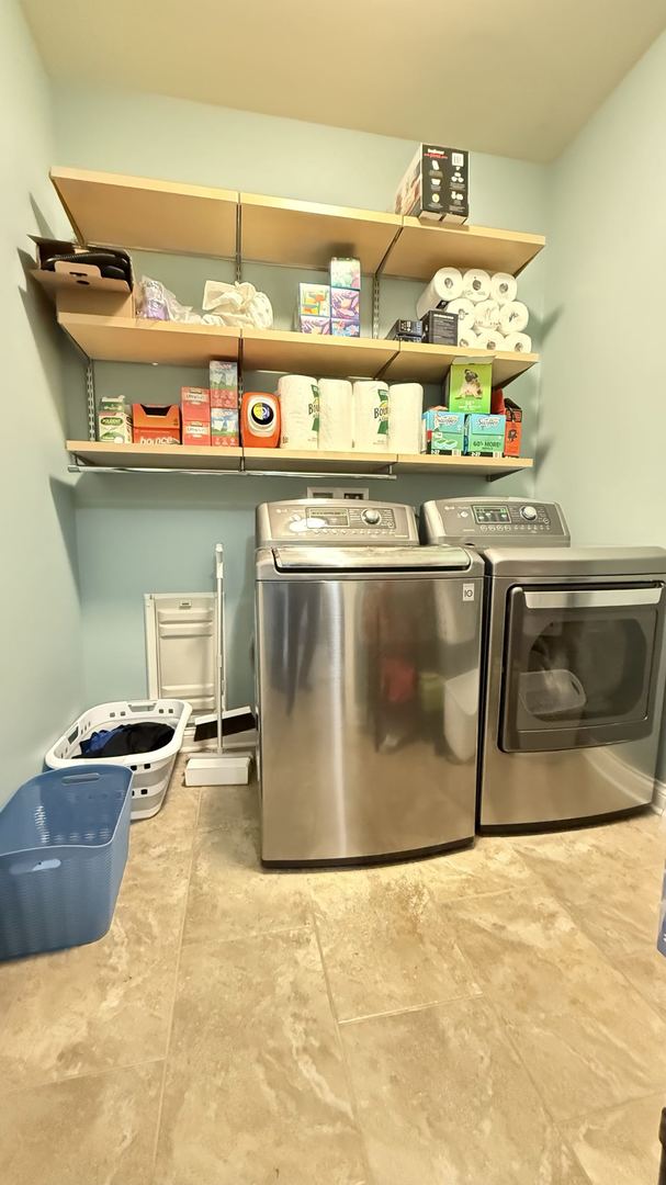 laundry room with washing machine and dryer