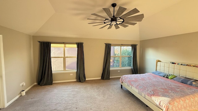 carpeted bedroom featuring lofted ceiling, multiple windows, and ceiling fan