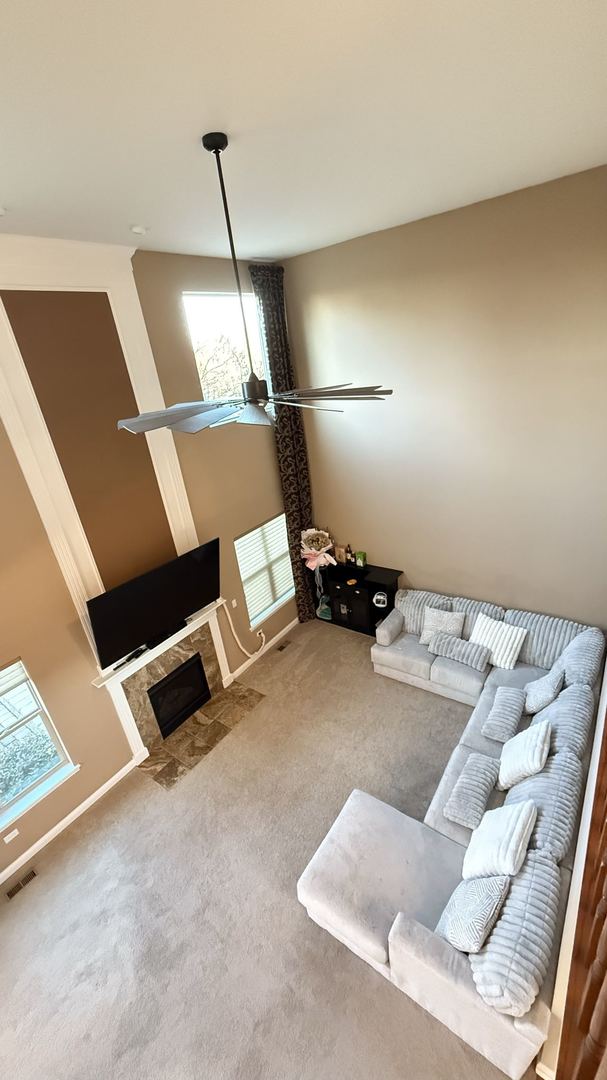 unfurnished living room featuring carpet flooring