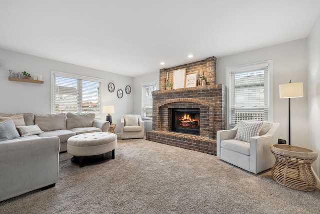 carpeted living room with a fireplace