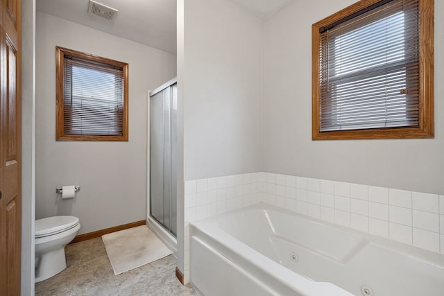 bathroom with tile patterned flooring, independent shower and bath, toilet, and a wealth of natural light